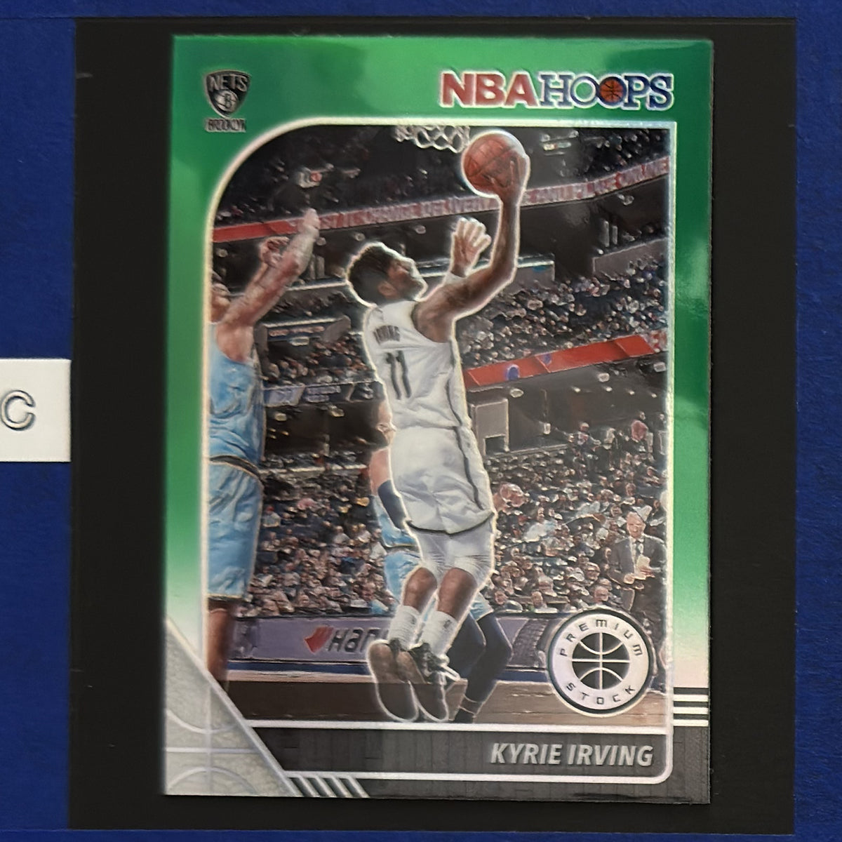 2019-20 Panini NBA Hoops Premium Stock Green Prizm Kyrie Irving #11 — front view