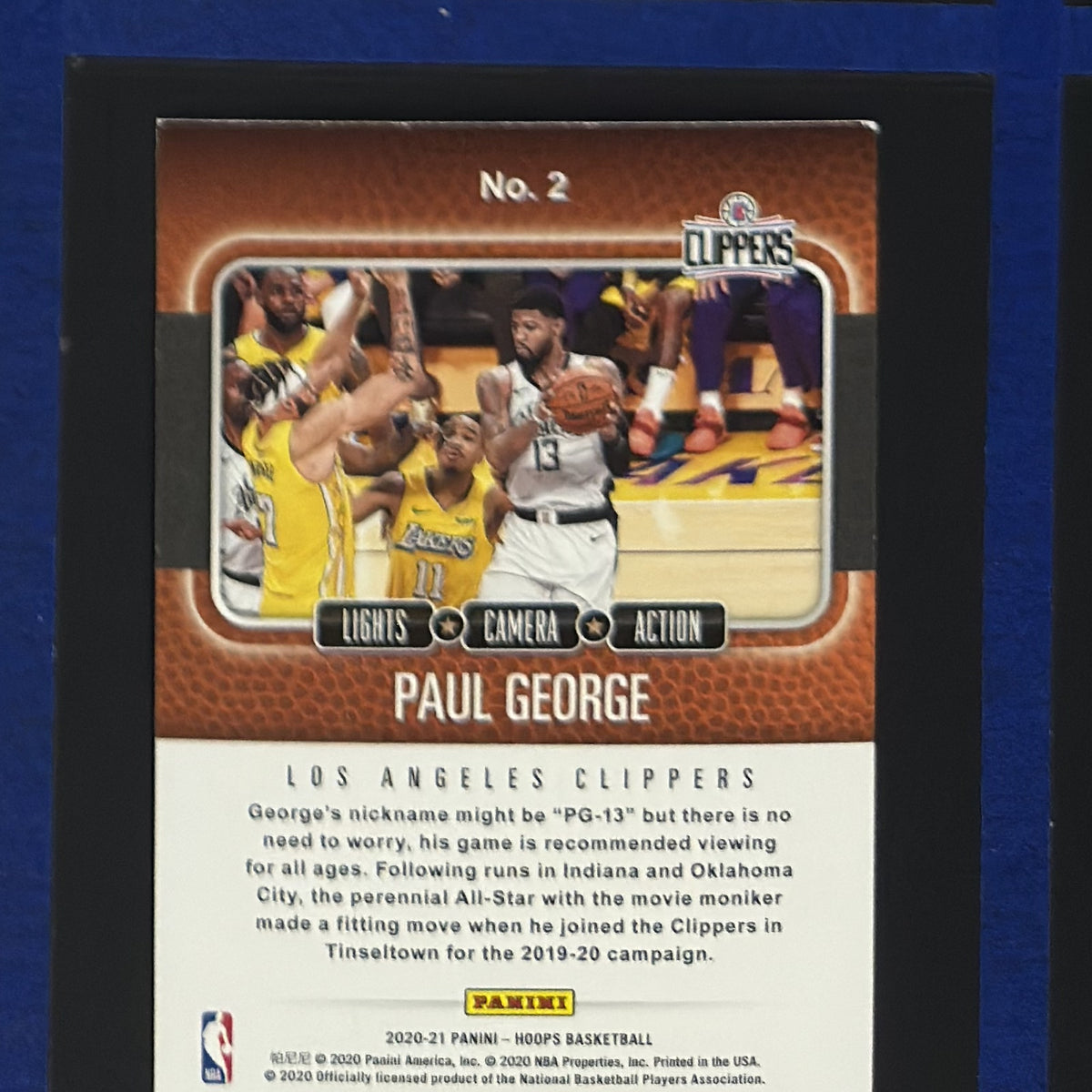 2020-21 Panini NBA Hoops Lights Camera Action Paul George #2 — back view